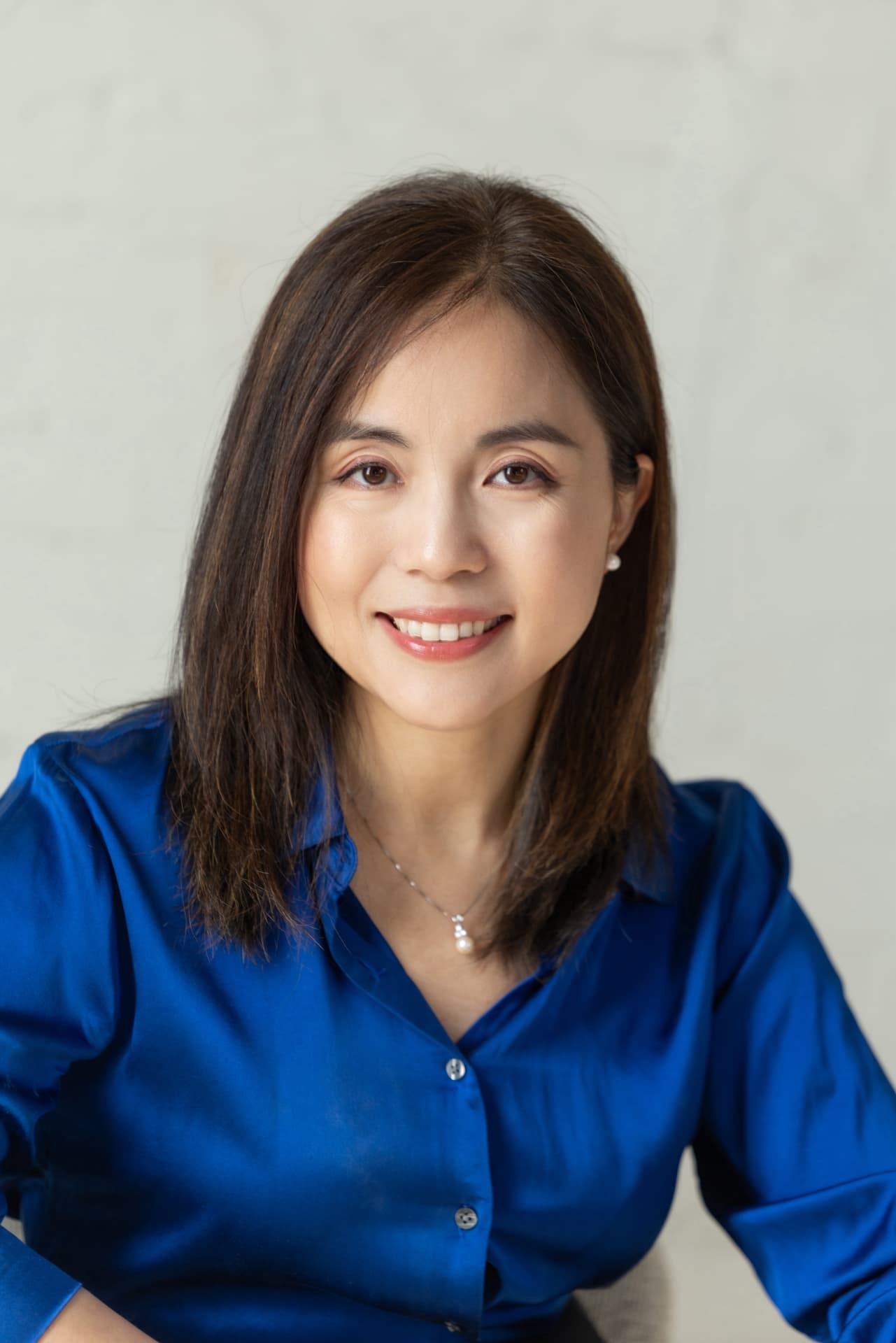 Portrait of Angela Zhou, founding broker of TrueStone Realty